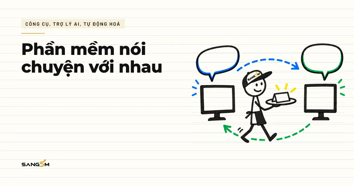 Người que đội nón SANG5M làm người phục vụ, bưng khay đi giữa hai màn hình máy tính có bong bóng lời nói trống