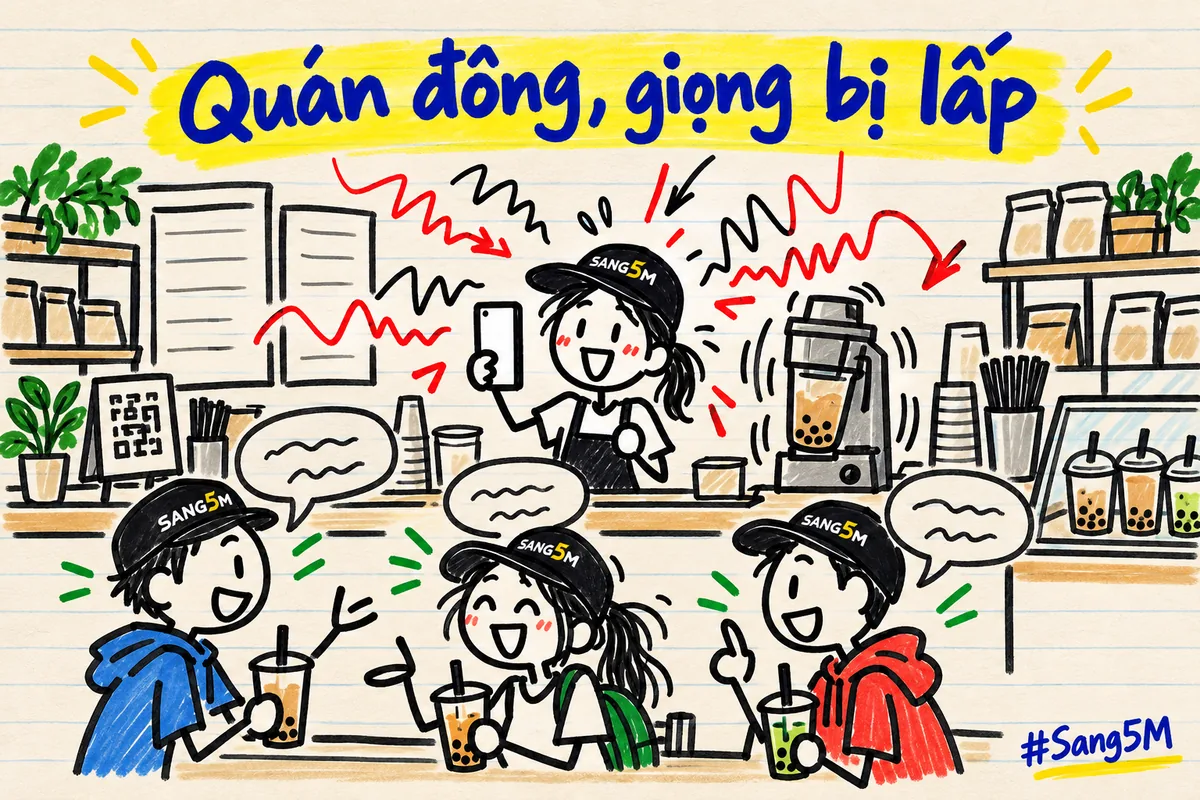 Quầy trà sữa đông khách, máy lắc rung, sóng âm rối bay quanh chủ quán đội nón SANG5M đang cầm điện thoại quay.